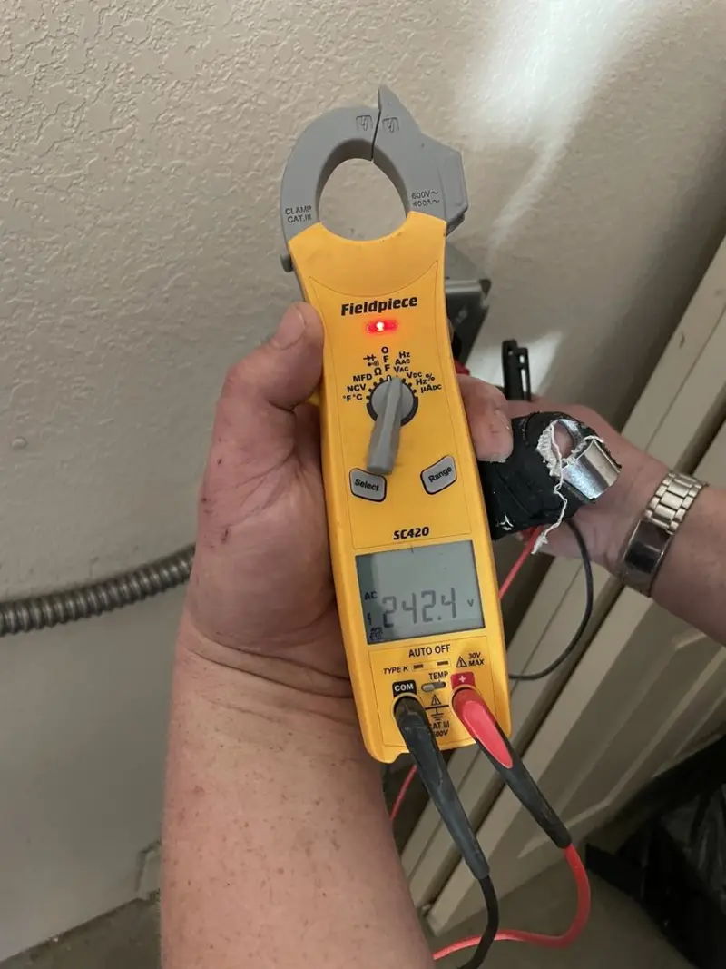 Voltage testing with clamp meter during Recessed Lighting Installation in Minooka